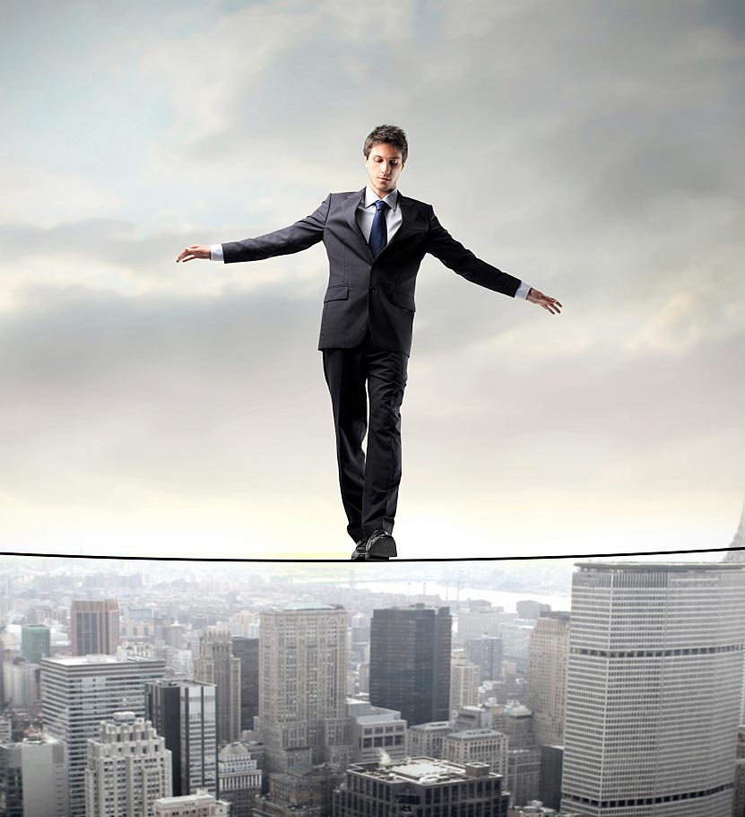 Person Walking the Wire Over City Person Walking the Wire Over City